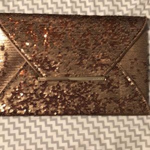 BCBG Maxazria rose gold envelope clutch